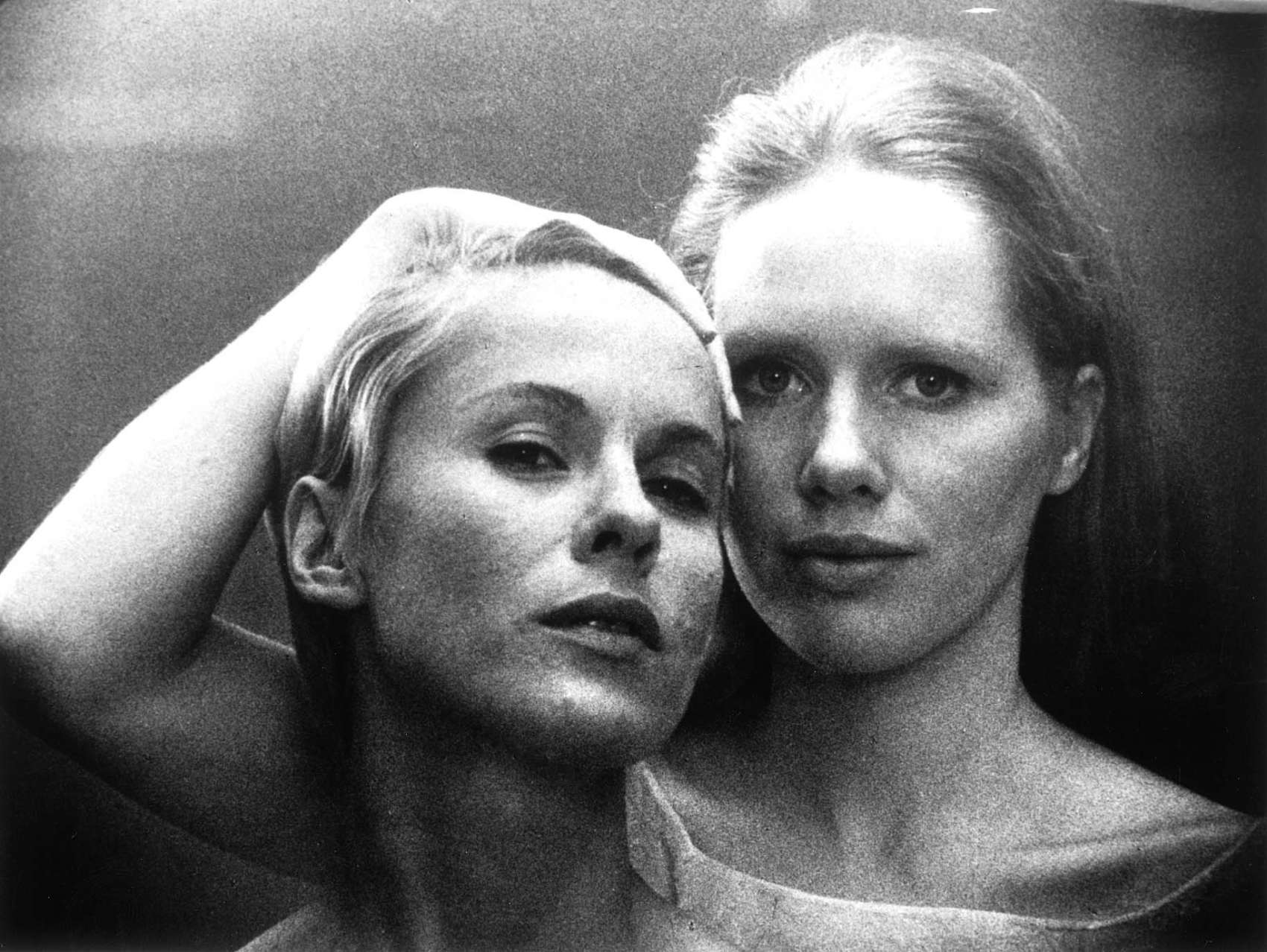 Promo shot from film Persona - head shot of two women one holding the other's hair
