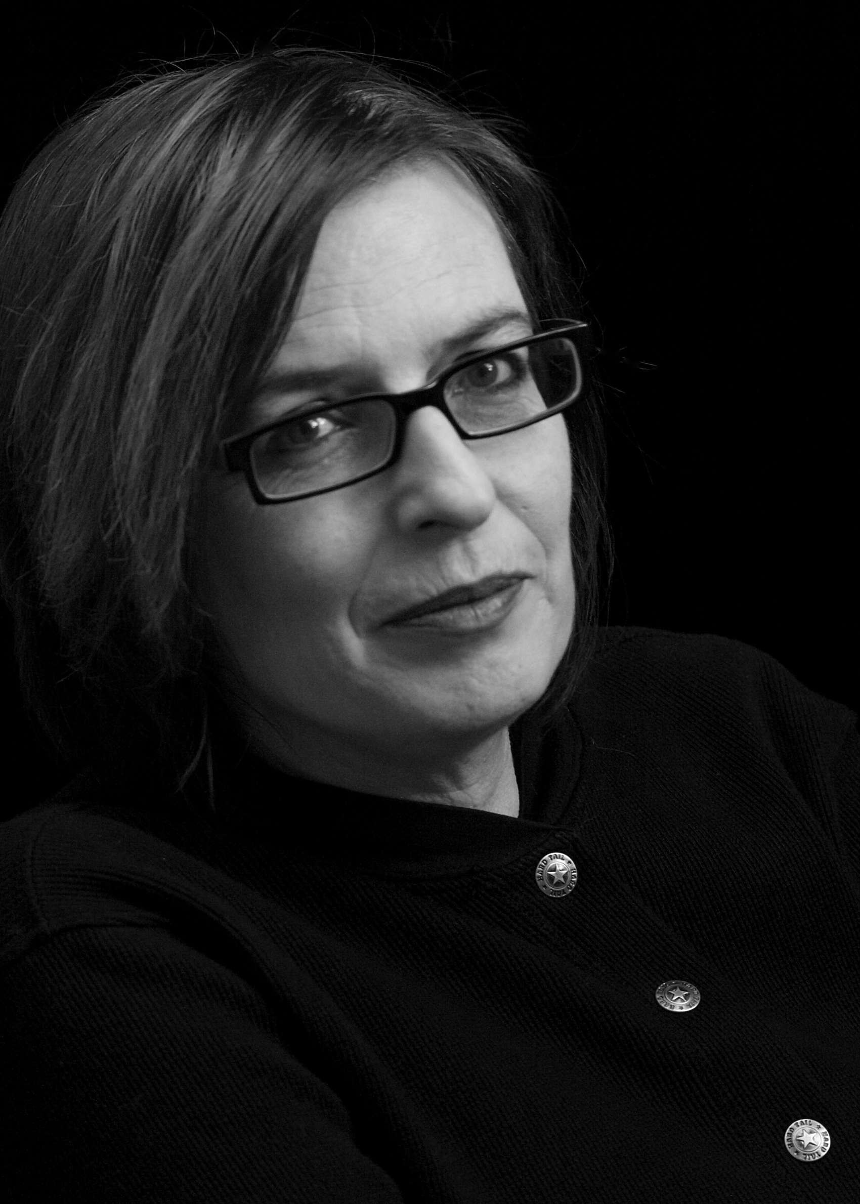Black and white profile of woman wearing glasses